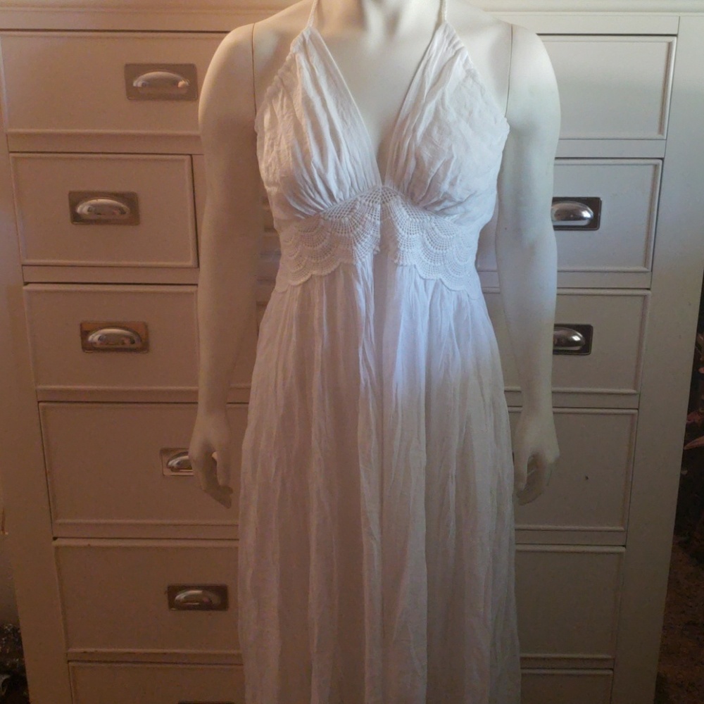 Floor length white sun dress.
